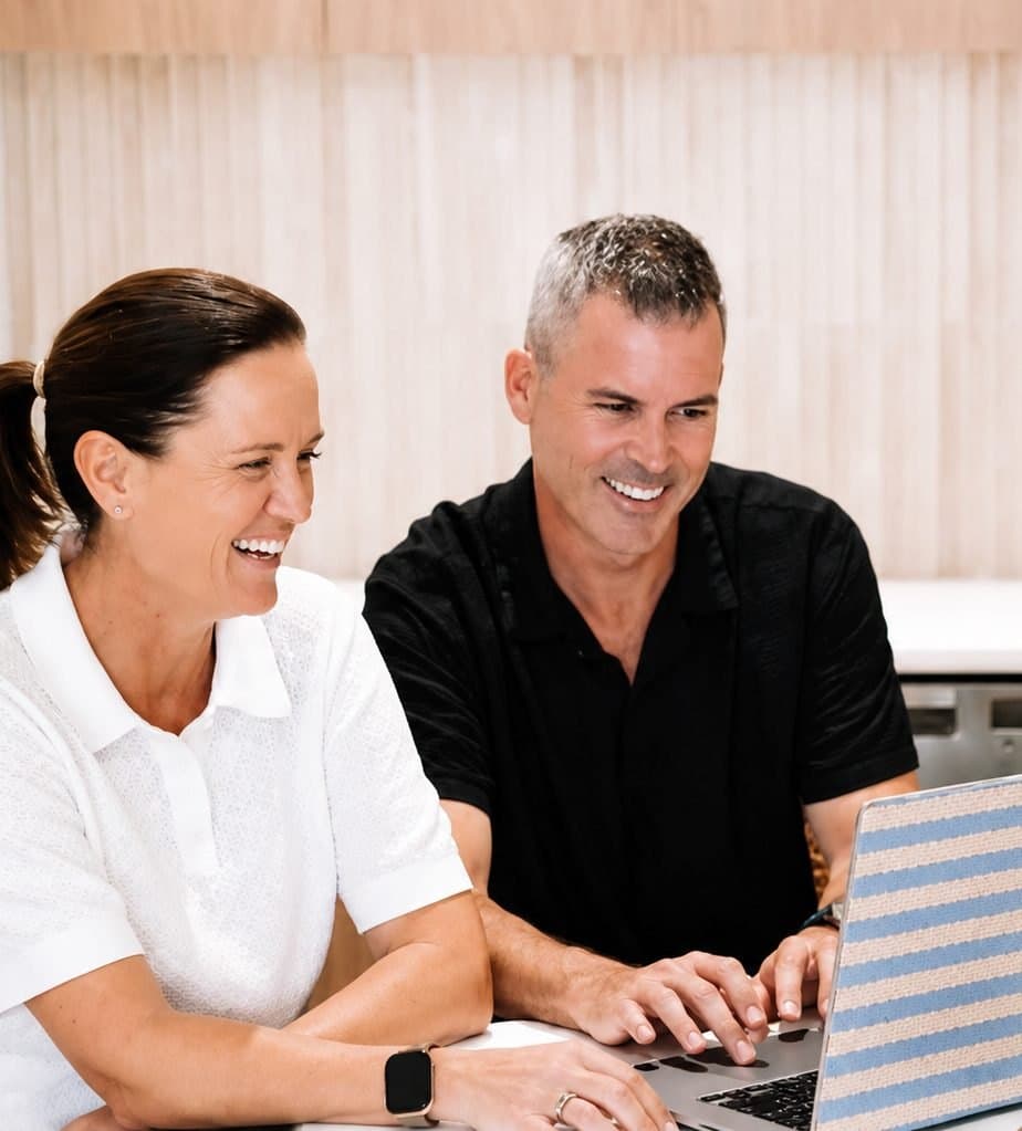 Two Hello Capital clients reviewing their finance options at home